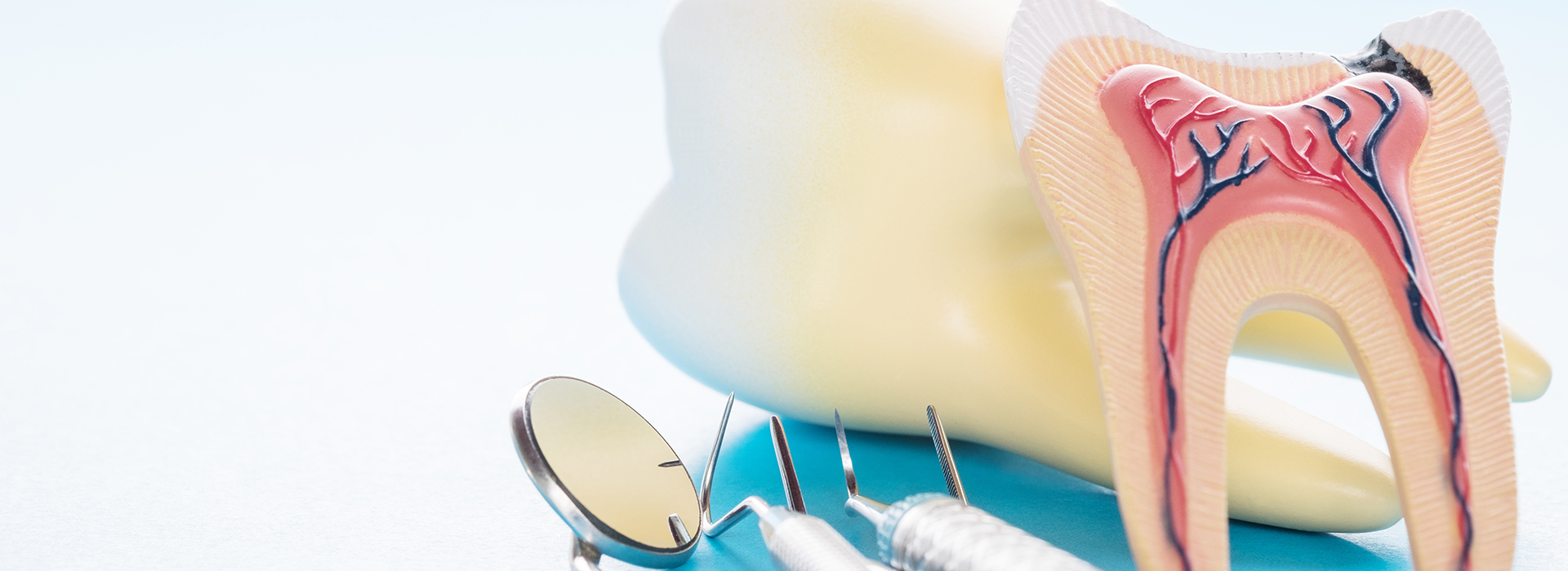 The image shows a toothbrush with a toothpaste tube featuring cartoon-like representations of teeth and gums, set against a background with a watermark that includes a toothpick and dental floss.
